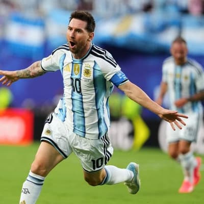 Messi magic gets defending champions going at World Cup