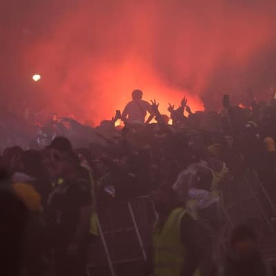 Socceroos fan suffers flare to face in World Cup chaos