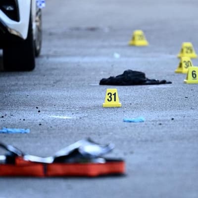 Innocent man almost mowed down after gangland shooting