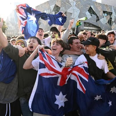 Fans kick on after teen arrested at Socceroos live site