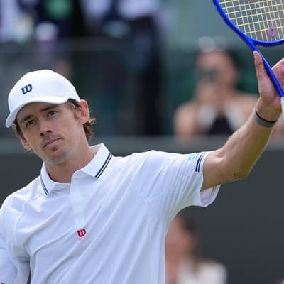 De Minaur casts off nerves to advance at Wimbledon