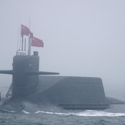 China test fires missile in Pacific as alliance struck