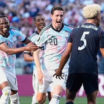 Belgium into QFs after beating last remaining co-hosts