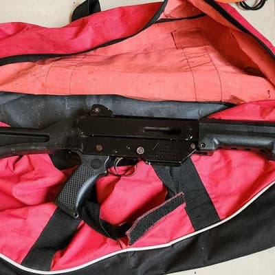 Military-style weapons seized in safe house raid
