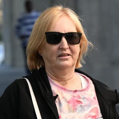 Mum cleared of two murders to wait on fraud charges