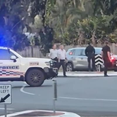 Man charged, cops probed after bystander shot in arrest