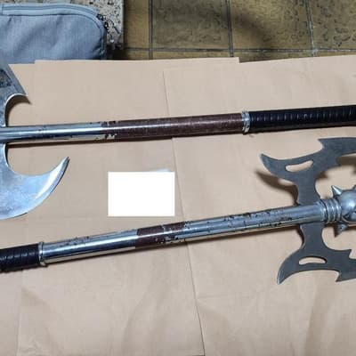Suburban raids net crossbows, guns and battle axes