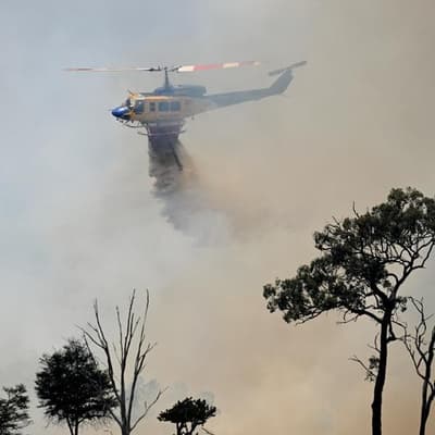 Two dead, Australian owned choppers crash in fire fight