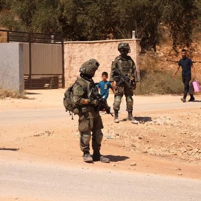 Israel sends troops as settlers besiege West Bank homes