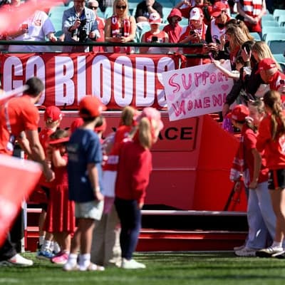 Swans fans turn out in tense return to footy field