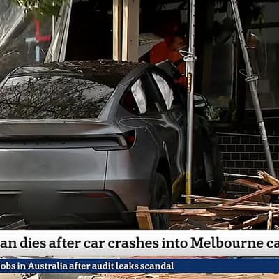 Woman dies after car crashes into shopping centre cafe