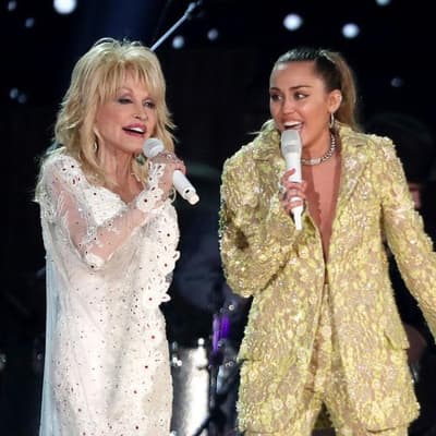 Miley Cyrus remembers 'angel' godmother Dolly Parton