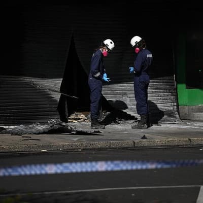 Manhunt as tobacco shop arsonist 'left for dead'
