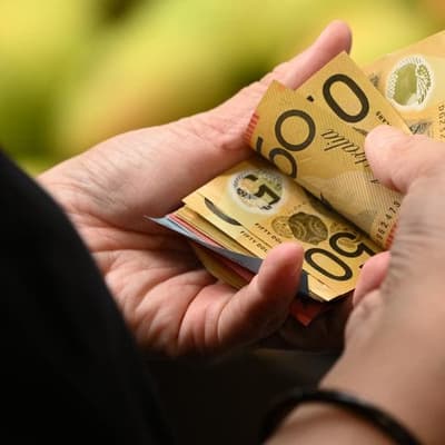 Bribery accused denies link to wife's death overseas