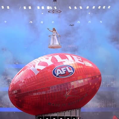 'So lucky': Kylie lights up rain-soaked AFL grand final