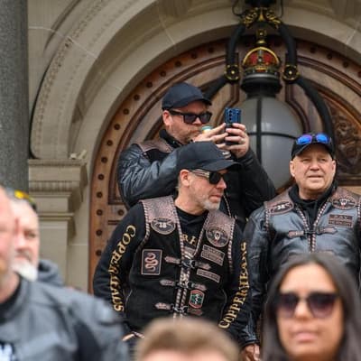 Riders rally over potholes as land tax cut locked in