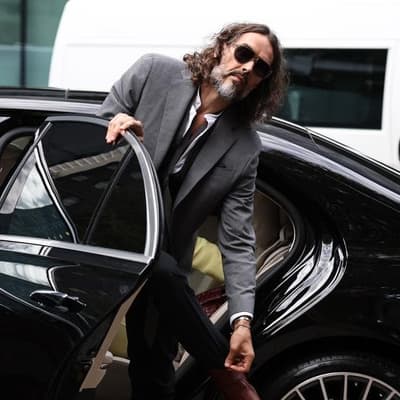 Russell Brand at court for hearing before rape trial