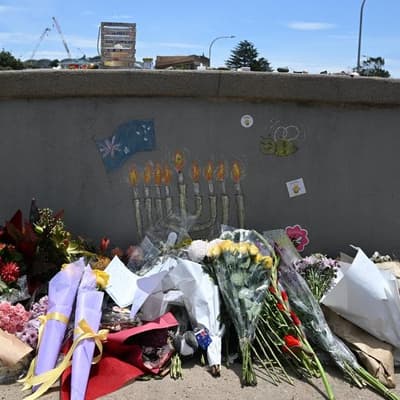 Man charged over 'offensive' act at Bondi attack site