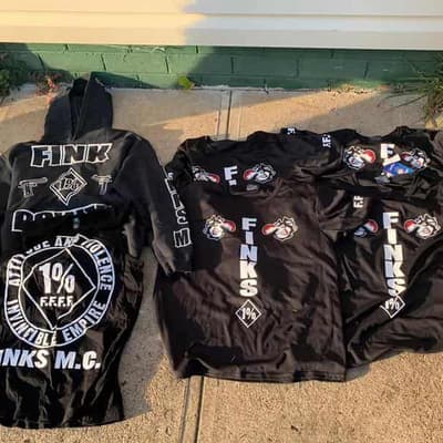 Two alleged Finks bikie members charged after raids