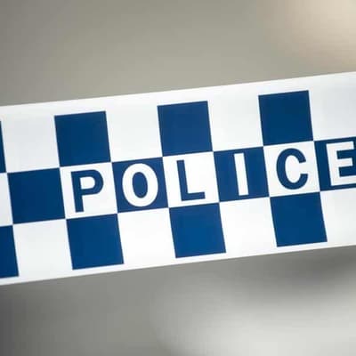 Son charged with murder of man found dead in backyard