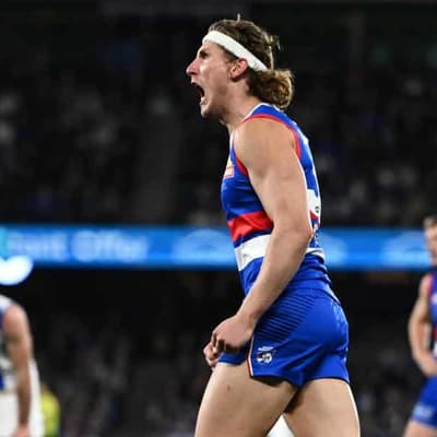 Dogs' star Naughton to stay forward despite injuries