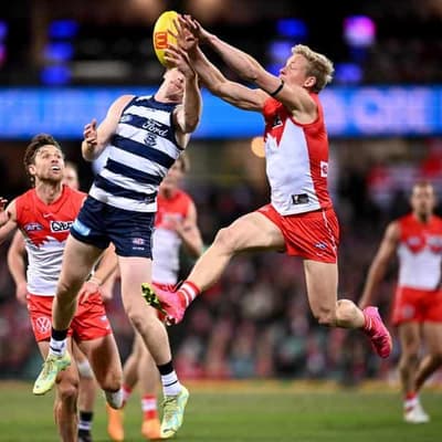 Heeney snatches draw for Swans against Cats