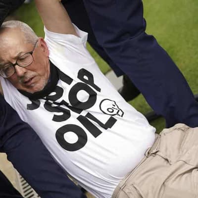 Saville derailed by protester on tough day for Aussies