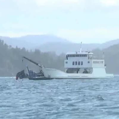 Crew named as search continues for defence helicopter