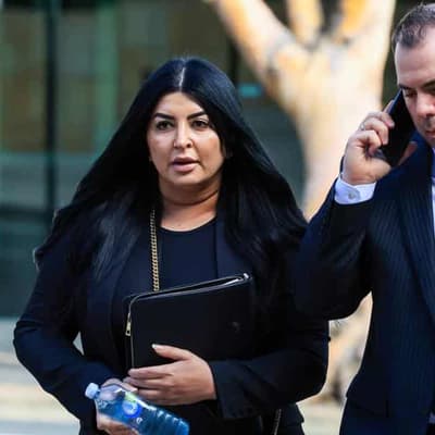 Lawyer accused of hiding her husband's link to murder