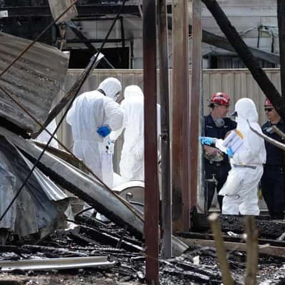 Arson ruled out as family fire tragedy cause a mystery