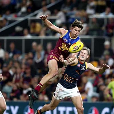 Lions survive Crows AFL comeback in tense Gabba win