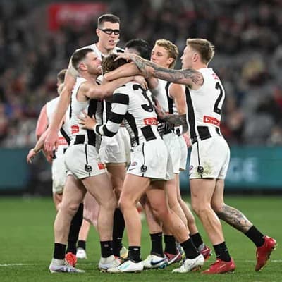 Magpies massacre Bombers to seal AFL minor premiership
