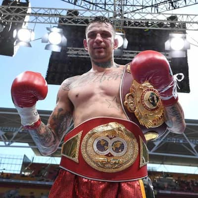 Ex-world boxing champ sentenced for violent car robbery