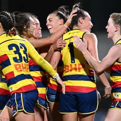 Crows outclass plucky Tigers in wet weather skirmish