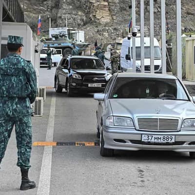 Ethnic Armenians flee Karabakh after region's defeat