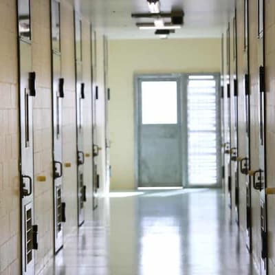 Woman bribed guard to smuggle drugs to jailed partner