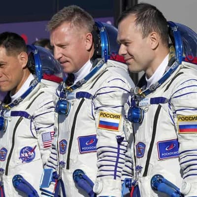 Three astronauts return to earth after a year in space