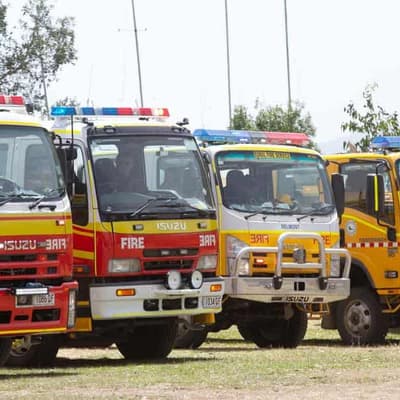 Man accused of stealing two fire trucks as Qld burns